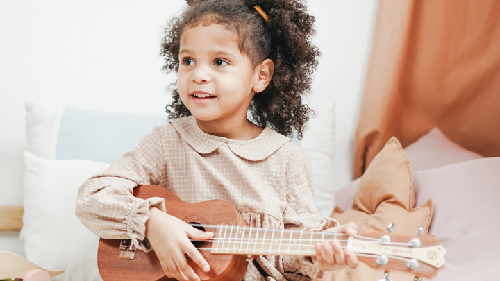 Girl Playing the Ukulele