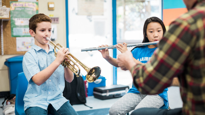 Children playing music in elementary school