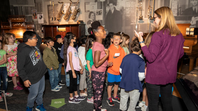 A classroom visiting the Museum of Making Music