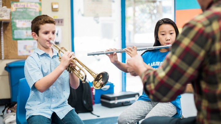 Children playing music in elementary school