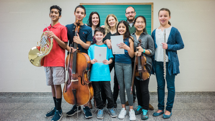 Middle School Students Making Music in a classroom