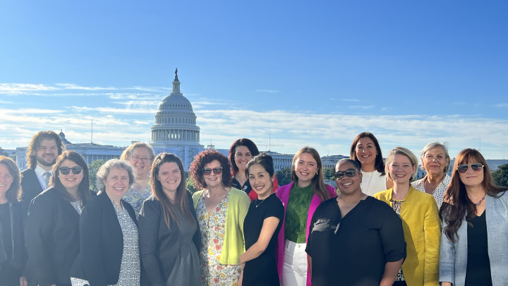 NAMM Music Education Advocates standing on the balcony with Capitol in the background in Washignton DC
