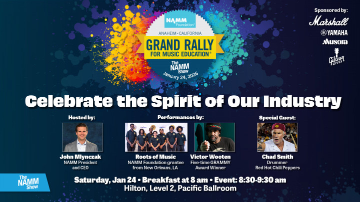 Image of The Grand Rally for Music Education logo and host John Mlynzack NAMM President and CEO Victor Wooten Chad Smith and student ensemble Roots of Music